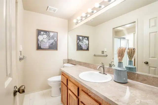 Full bathroom features brand new vinyl flooring.