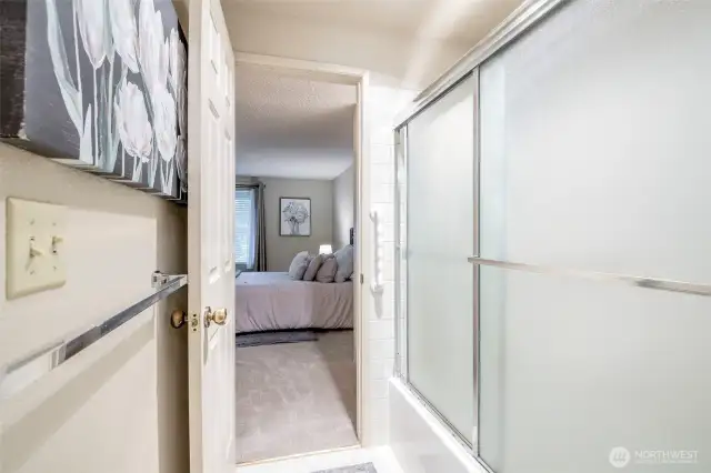 View from bathroom to primary bedroom.