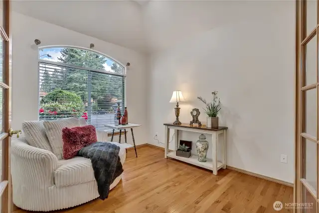 This well-lit and spacious den or office provides a quiet retreat for work or relaxation. Large windows and ample room make it both functional and comfortable.