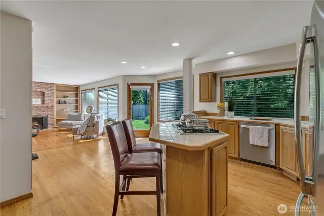 The spacious kitchen and expansive gathering area offer direct access to the beautiful backyard, perfect for indoor-outdoor living. This seamless connection makes entertaining effortless and enjoyable.