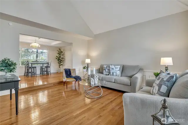 The formal living and dining rooms offer an elegant setting, ideal for hosting guests or celebrating special occasions. Sophisticated finishes and an open layout create a warm and welcoming atmosphere.