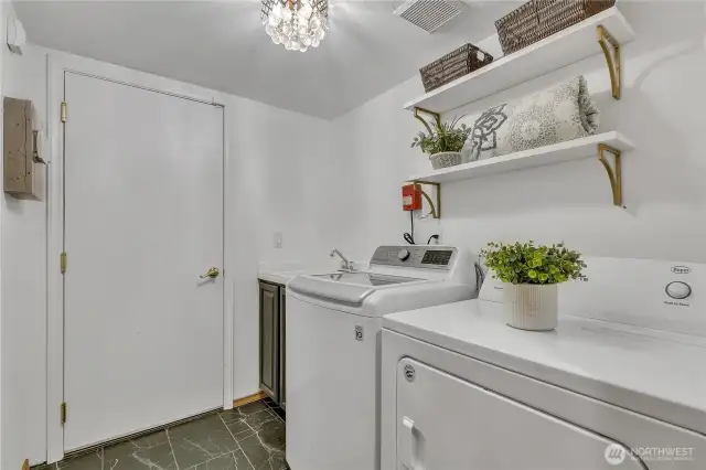 Main level utility room with access to 2 car garage.