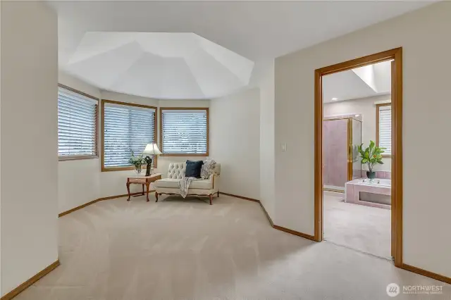 The primary bedroom is generously sized, featuring a spacious layout with dual relaxing areas. It’s the perfect retreat for both rest and rejuvenation, offering plenty of room to unwind.