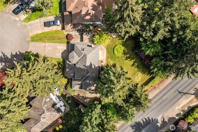 This aerial view of the property showcases .30 acres of serene outdoor space, perfect for relaxation and recreation. The expansive yard offers plenty of room for activities or peaceful enjoyment.