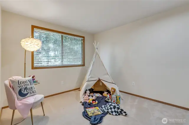 The third bedroom on the second level is spacious, features a large closet, and is tucked away for added privacy. It’s a quiet, cozy retreat perfect for rest or relaxation.