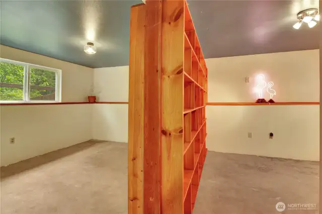 There's a dividing wall in the bedroom downstairs.