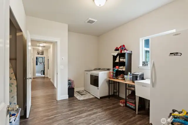 Huge laundry room with soaking tub, Tons of storage.  This house doesn't lack storage!