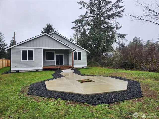 Private rear yard on the canal with integrated fire pit