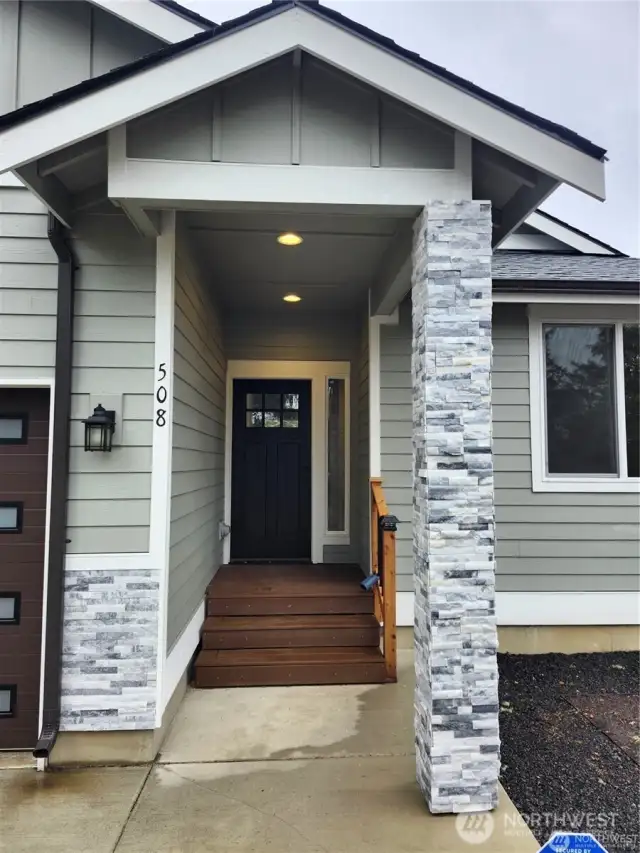 Stone pillar welcomes you to covered front porch