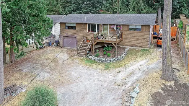 Aerial view of the home perched up on a hill with territorial views