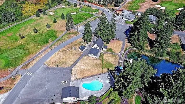 Aerial view of Camaloch's chalet, one of their pools and part of the golf course... all included in your HOA dues