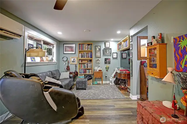 Another living space just off the kitchen, leading into the back multi-layered deck for entertaining guests
