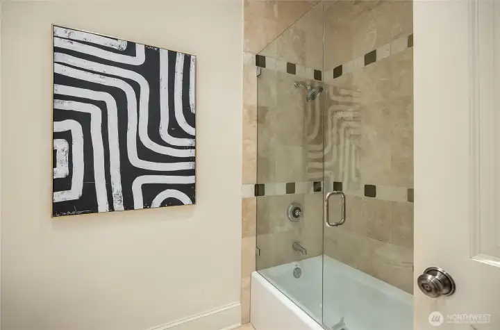 Full bathroom with a tub and shower.