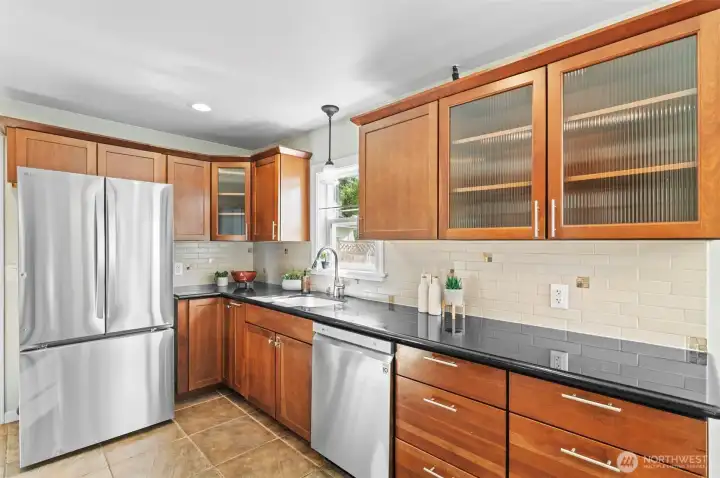 Wow! So many cabinets, newer appliances, and everyone loves a kitchen sink window.