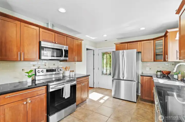 Easy access to backyard and the 3rd bedroom is located just off to the left... also works as an office.