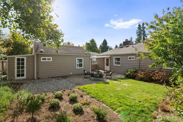 Generously sized yard with spacious patio, garden shed, and potting area.