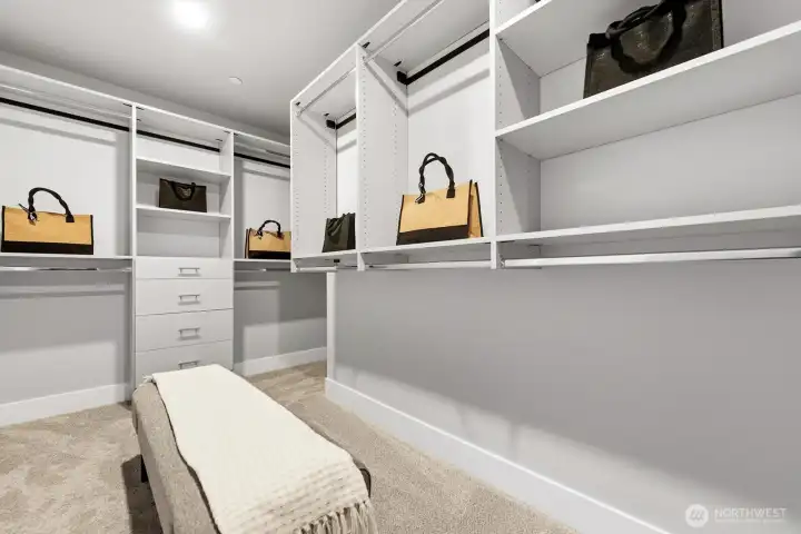 Walk-in closet off of primary bedroom. Walk-in closet off of primary bedroom.