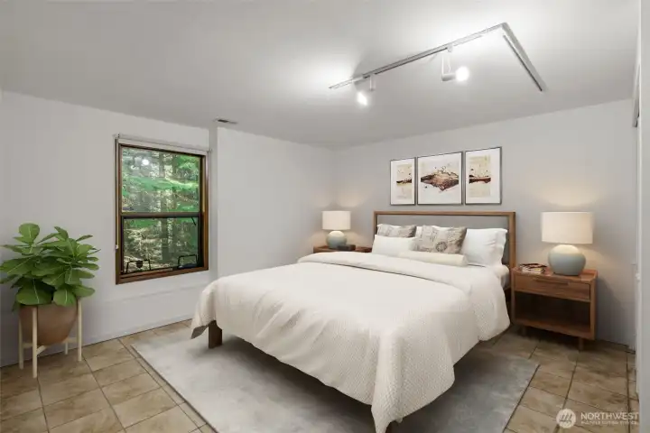 4th Bedroom downstairs with tile floors. (virtually staged)
