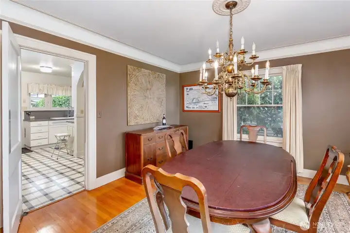 Dining room with swinging door into kitchen.