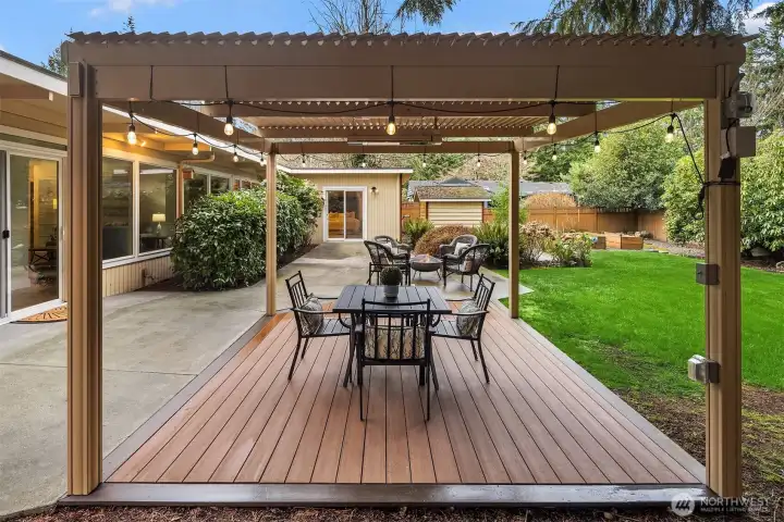Across the patio, is the sliding glass door access from the primary bedroom.