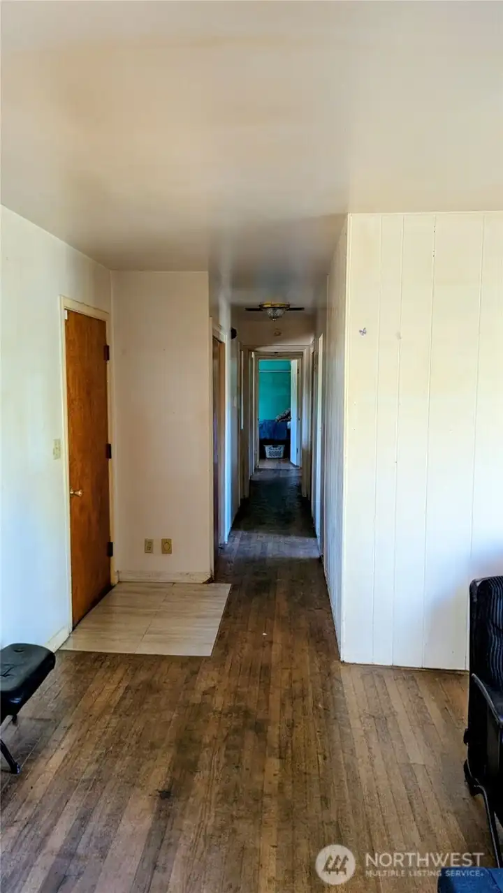 Interior view of entry; Uncovered original Hardwood floors can be brought back to life easily