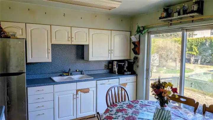 Kitchen with sliding glass doors to huge backyard space