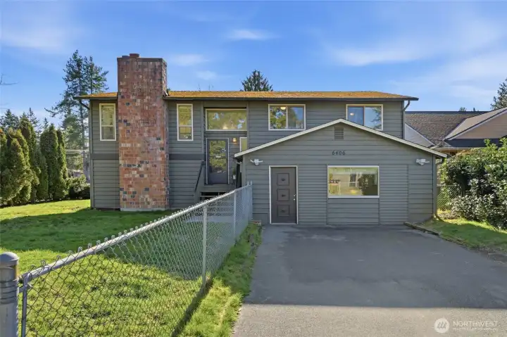 Warm and welcoming street presence on an oversized lot in a prime, convenient location.