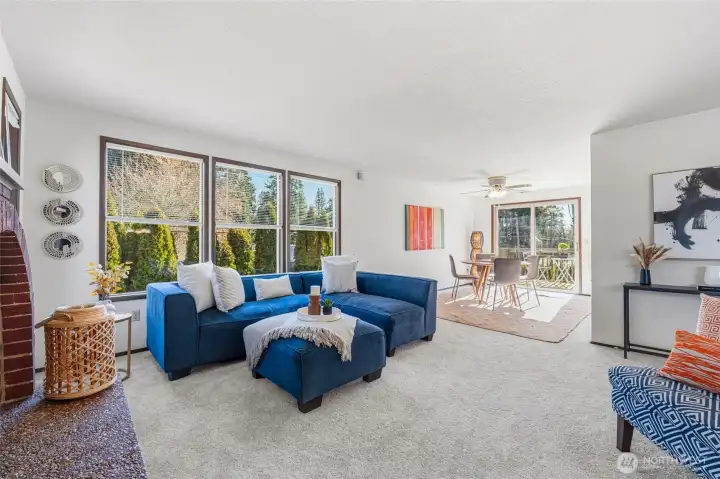 Light-filled living room with abundant windows creating an airy, inviting atmosphere.