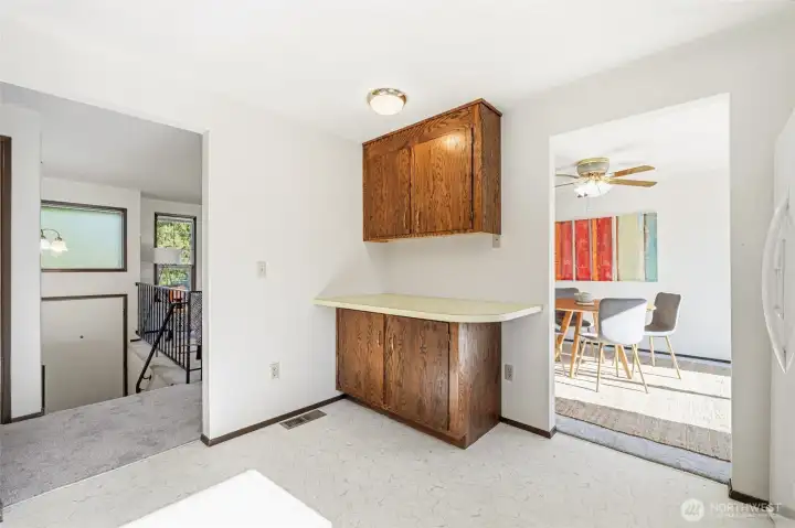 Extra counter and cabinets provide added workspace and organization.