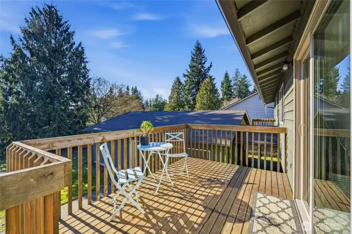 Deck off the dining area, ideal for outdoor dining, relaxing, or barbeque gatherings.