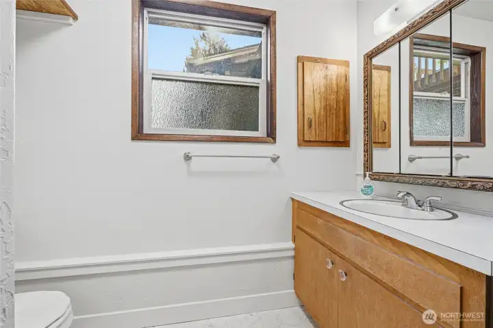 Convenient downstairs 3/4 bath serving the lower-level living areas.