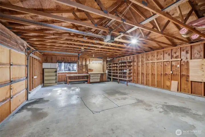 Interior of detached garage/shop offering generous space for storage, parking, or projects.
