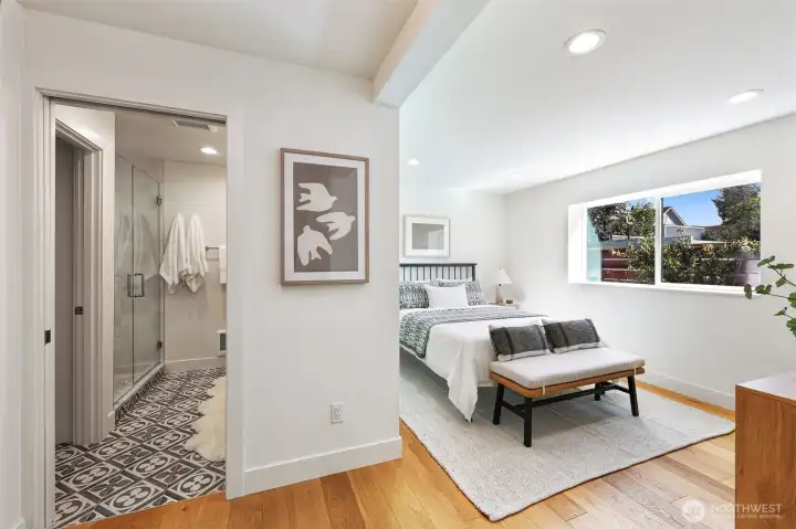Primary suite with attached bath and walk-in closet