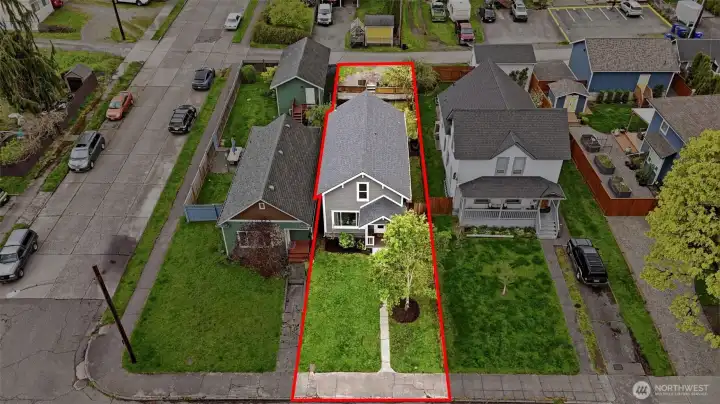 Deep lot with designated off-street parking in the back, offering both space and everyday convenience