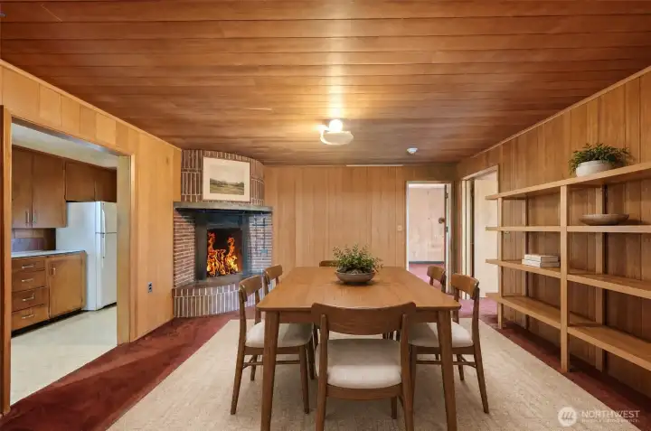 Inviting dining room with the original fireplace. Virtually staged.