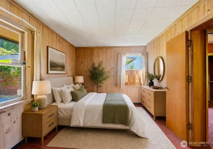 Bedroom 1 with water views. Virtually staged.