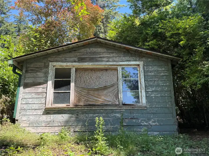 Additional building on the lot. Ready for a complete rehab, this would make for and amazing office or?