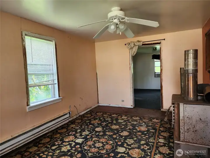 Living room has wood stove that is not installed but will stay with the home. Living room has wood stove that is not installed but will stay with the home.