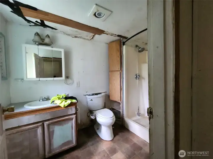 Bathroom will need repairs to the ceiling and roof. Bathroom will need repairs to the ceiling and roof.