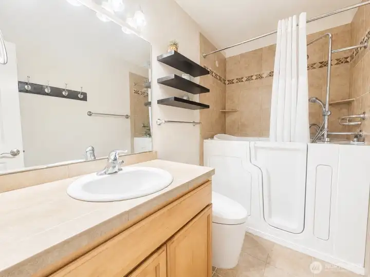 Full bathroom with deluxe walk-in tub & shower. Hydrotherapy with Whirlpool Jets, In-Line Heater to maintain warmth when soaking, heated backrest/seat, fast fill faucet, quick drain technology 45-60 seconds to drain, so you don't have to sit in the cold.