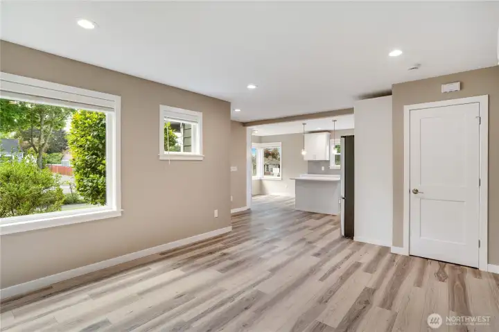 Inside, you’ll find a generous layout with sunny windows, open sightlines to the kitchen, a useful coat closet, recessed lighting, fresh millwork, and new LVP flooring—every detail rebuilt from the studs for long-term durability.
