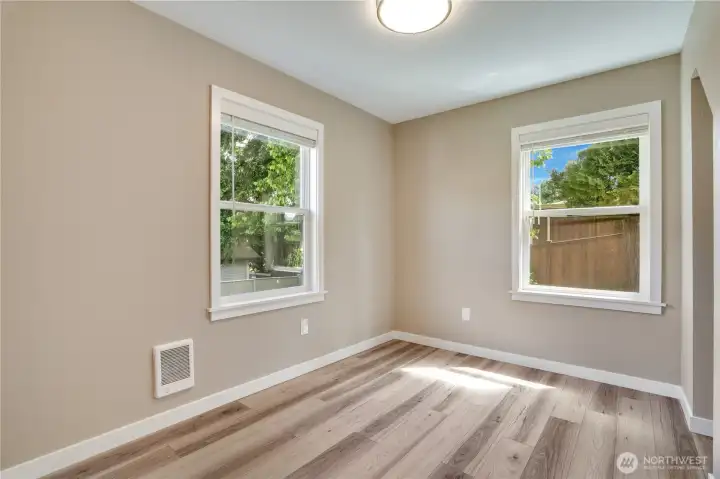 The second bedroom continues the updated aesthetic with a private position at the rear of the home.
