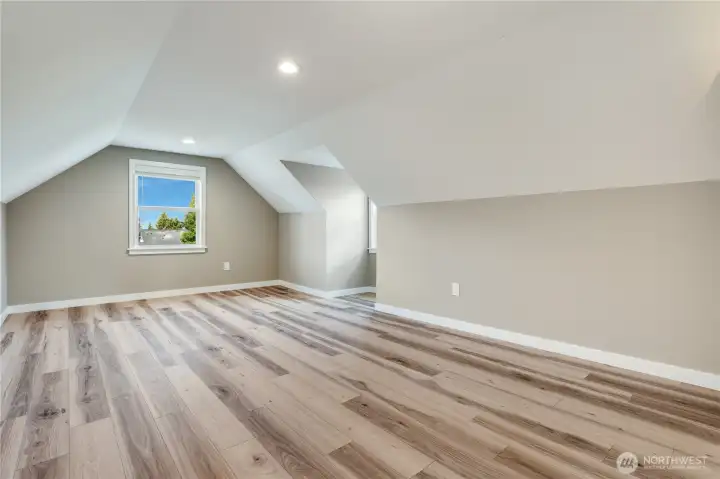 With room for a king-size bed, dressers, or even dual desks for a full office, this spacious room highlights its versatile layout and generous footprint.