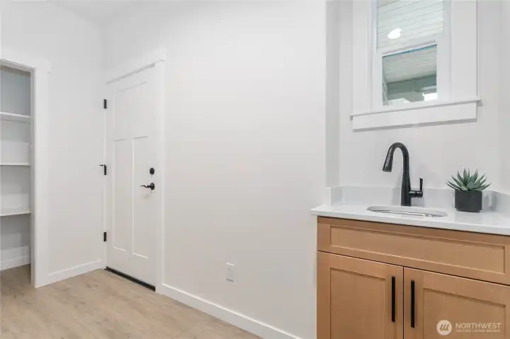 Utility Room with door leading to the garage.