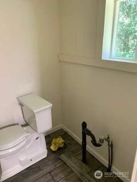 Bathroom plumbing ready for sink and counter top.
