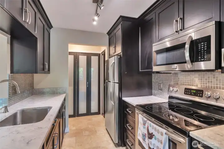 Kitchen with beautiful cabinetry and counters Kitchen with beautiful cabinetry and counters