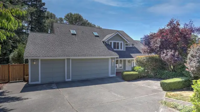 Expansive driveway provides tons of guest parking, turn around area, plus a three car garage.