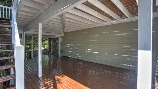 Additional covered area just below the deck offering a shaded spot to enjoy your peaceful back yard.