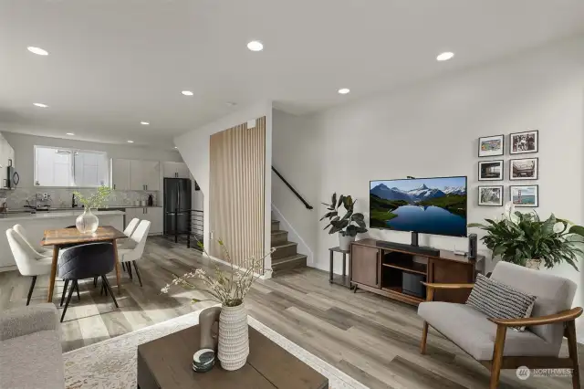 The open layout connects the living room, dining area, and kitchen, making this space perfect for daily living and entertaining.