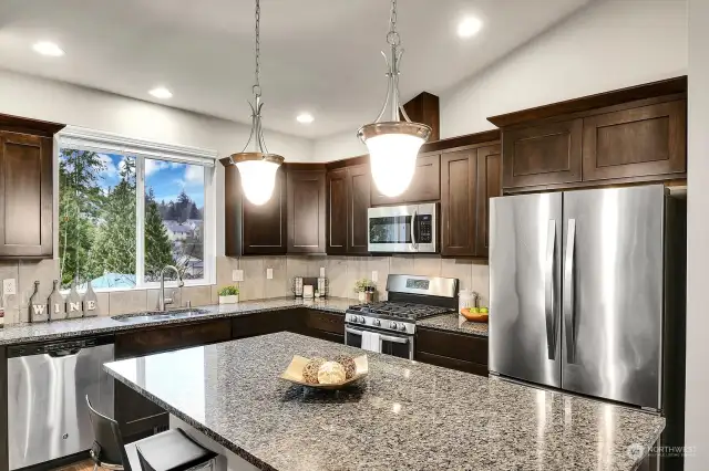 Additionally, the kitchen features a good sized central island with storage.